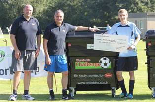 Ben Torn of Singleton Birch collects his cheque for winning the Wheelie Bin Challenge, sponsored by Taylor Bins